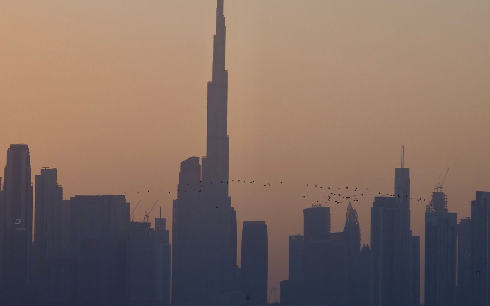 Dubai skyline at sunset during a quarterly property market review