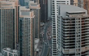 Road through a Dubai high-rise district for a guide to buying costs